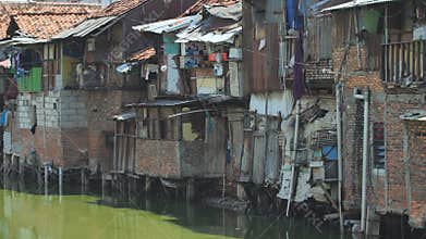 Jakarta, Indonesia - January 15, 2019: Slum area on the riverbank in Jakarta. Indonesia.