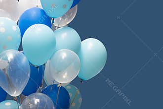 Colorful balloons on blue background. happy new year and happy birthday concept