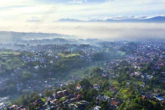 Countryside houses at misty morning in Bandung