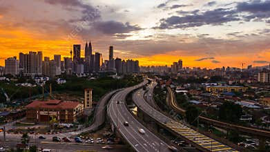 4K Cinematic Zooming out Time Lapse Footage of Kuala Lumpur city skyline during colourful sunset.