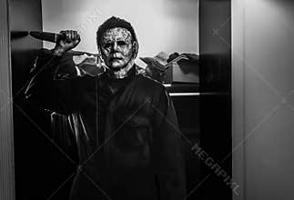 Recreation of a scene from the 1978 movie Halloween; Michael Myers the shape holding a knife Displays at the Theater