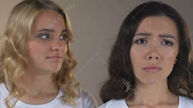 Asian with acne and skin pigmentation is jealous of her friend with healthy face