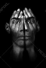 Hands trying to cover eyes