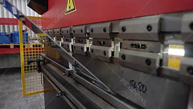 The process of the bending machine. Working metal bends. Close-up in motion.