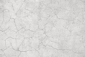 Light concrete wall with cracks