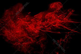 Abstract red  smoke on black background. Dramatic red smoke clouds. Movement of colorful smoke