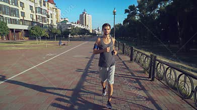 Jogger taining at day time in town.