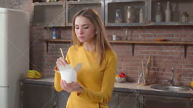 Female enjoy meal in flat.