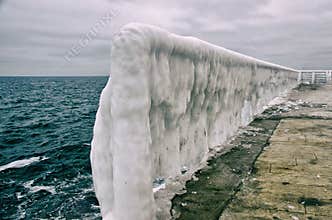 Ice-covered surface of the pier’s marina