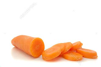 Partially sliced carrot.