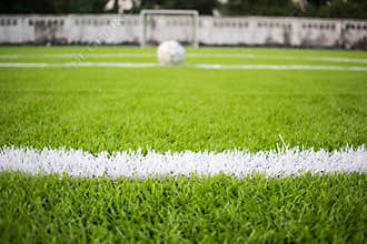 The white Line marking on the artificial green grass footbal, soccer field