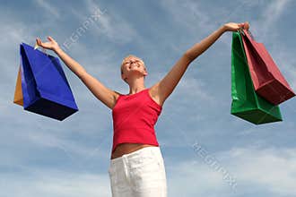 Happy woman with shopping bags