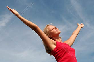 Happy woman with her arms wide open