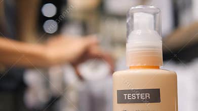 Young Mixed Race Woman Customer Testing Sunscreen Cream on Hand Skin in Cosmetics Supermarket in Shopping Mall. 4K.