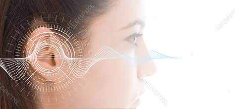 Hearing test showing ear of young woman with sound waves simulation technology