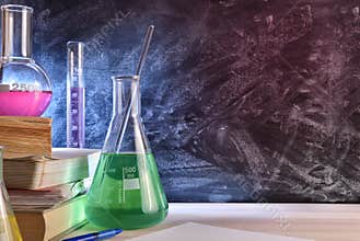 Classroom desk and blackboard of chemistry teaching close up
