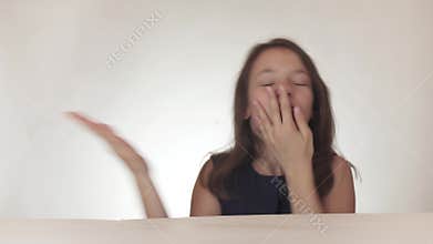 Beautiful naughty teenage girl joyfully sends kisses to the air on white background stock footage video