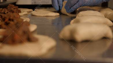 Baker working with bread dough