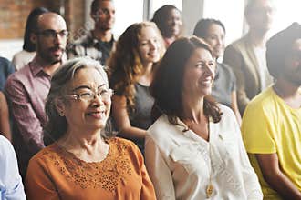A group of diverse audience in a meeting
