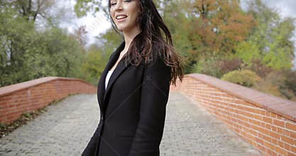 Cheerful woman on bridge