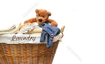 Laundry full of towels with teddy bear