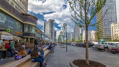 Walk on New Arbat Avenue timelapse hyperlapse popular tourist street in Moscow with shops and cafe in sunny summer day