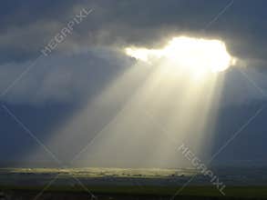 Sun Rays falling through the Clouds