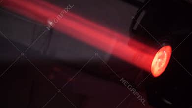 Camera Shows Powerful Red Light Laser Projector in Darkness