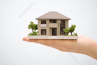 Model House with a Hand
