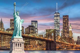 The Statue of Liberty and Brooklyn Bridge with World Trade Center background twilight sunset view, Landmarks of New York City