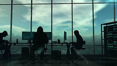Silhouettes of hackers at work