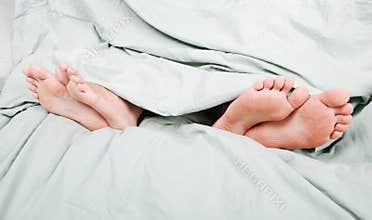 Angry couple in bed