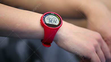Wrist digital watch on the woman`s hand