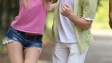 Girlfriend and boyfriend dancing together to energetic song at summer festival