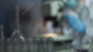 Researchers hard working in laboratories trying to create safe cure for cancer