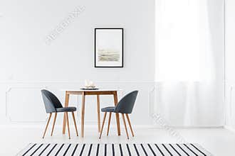Minimalist dining room with poster