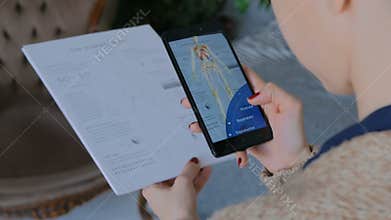 Woman using smartphone with augmented reality app