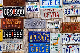 LUCKENBACH, TX - JANUARY 11, 2018 - Various old license plates d