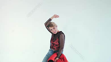 Young urban woman dancing. Girl dancing hip hop on white background. Ð¡yclorama