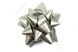 Silver Ribbon Bow Gift Decoration Metallic Minimal Macro Photography Studio Lighting Simple Clean Professional Design Elegant