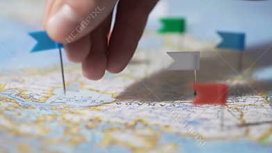 Hand making pin mark on Canada map, travel destination, company branch office