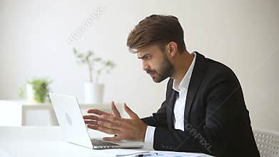 Angry emotional businessman troubled with sudden broken hanging computer failure