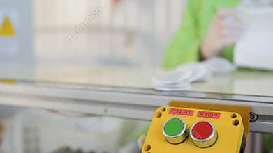 Worker stops conveyor belt