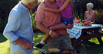 Happy girl, father and grandfather preparing barbecue 4k