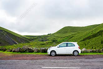 Beautiful Small white car standing by the road side