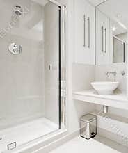 Modern bathroom with corner shower
