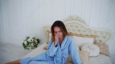 Women in Bad Mood, Upset and Crying, Sitting on Bed in Spacious Bedrooms.
