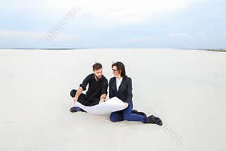translators wife and husband planning house at seaside.