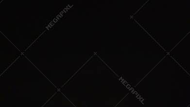 Multiple lightning forks flashing across dark night sky, thunderstorm with sound