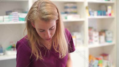 A veterinarian examines a white rabbit